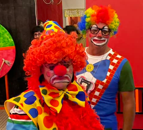 Mike and Diana dressed as clowns at the 2022 party