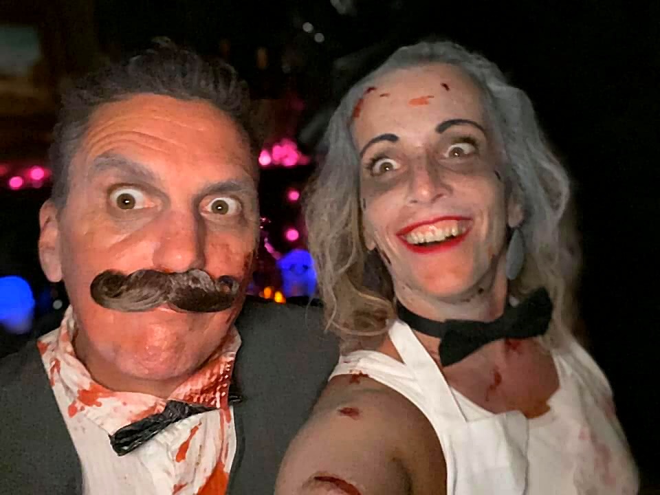 Two guests posing in eerie costumes at The Haunted Tavern in 2019