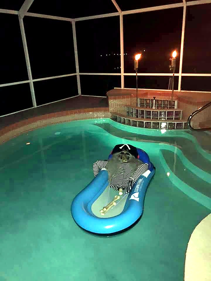 A skeleton relaxing on a pool float outside The Haunted Tavern in 2019