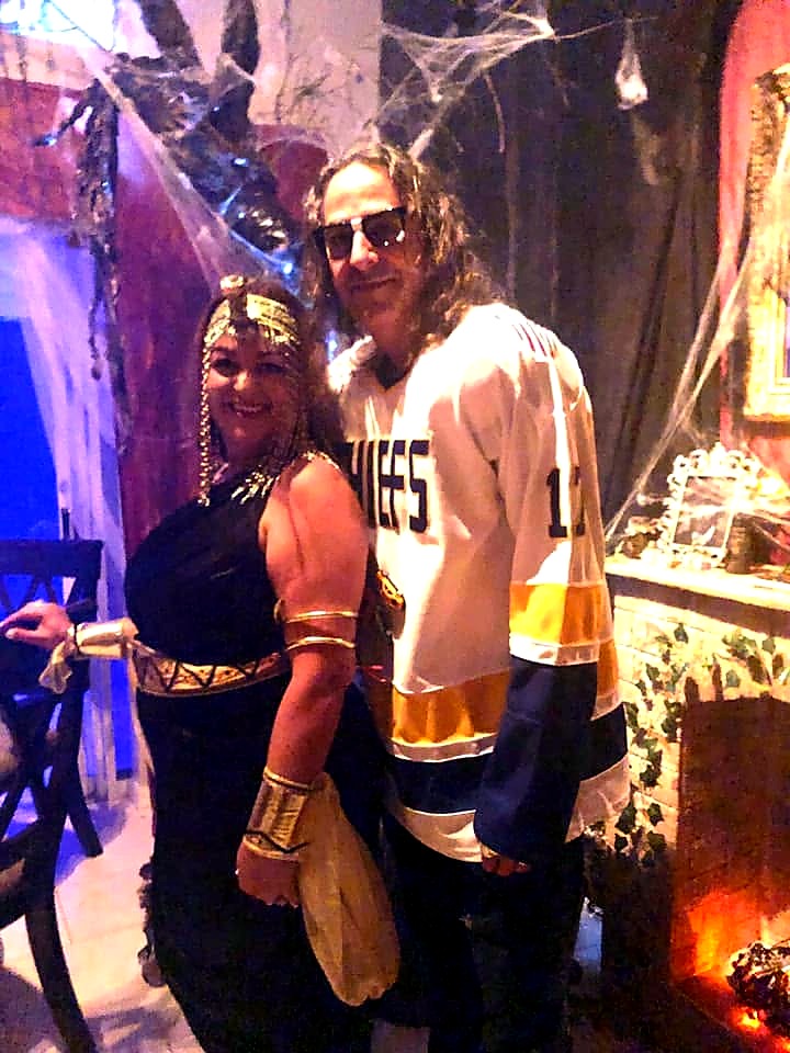 Two guests in contrasting Cleopatra and sports costumes at The Haunted Tavern in 2019
