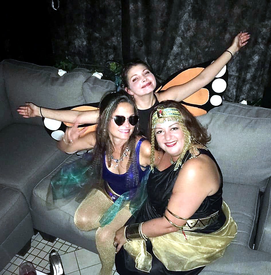 Three costumed guests relaxing together at The Haunted Tavern in 2019