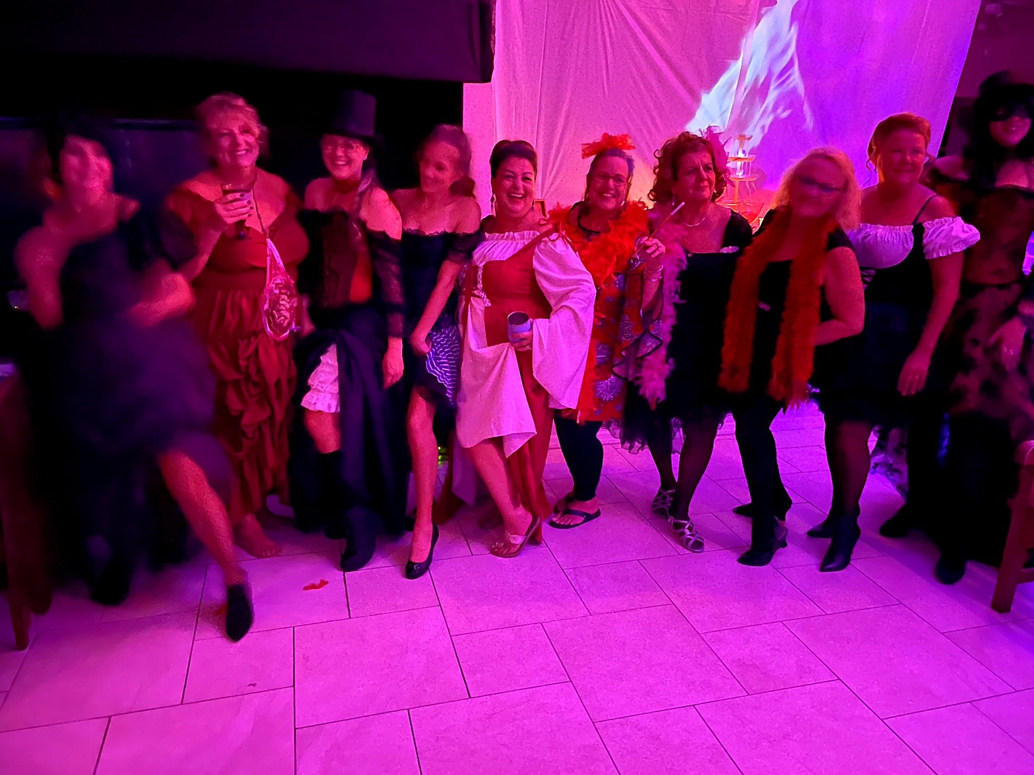 A group of guests dressed for the 2021 party theme