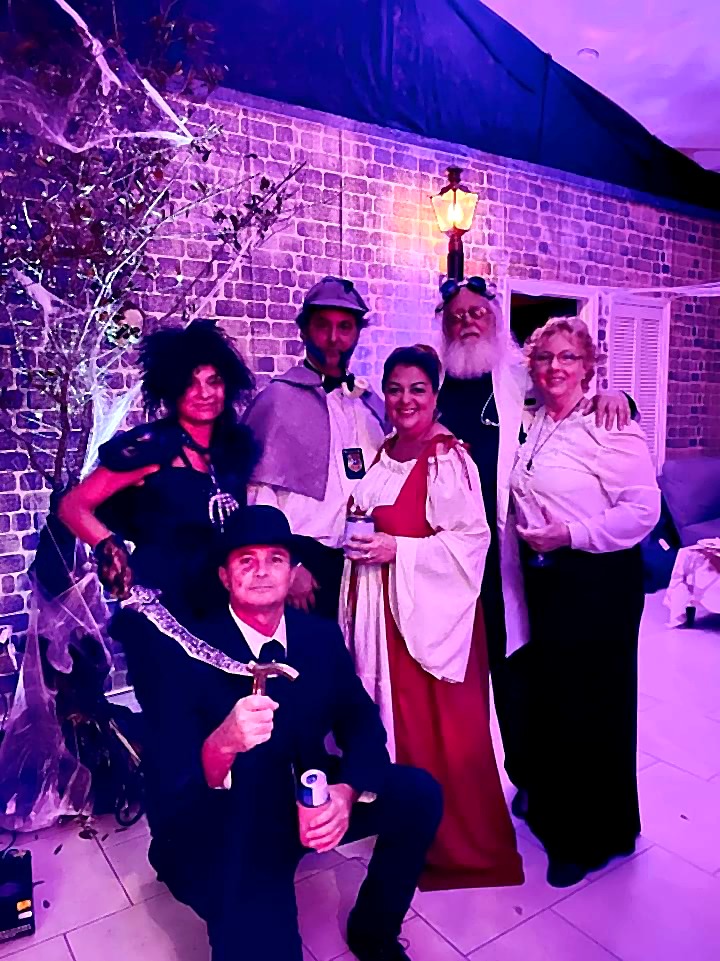 A posed group portrait from the 2021 themed party