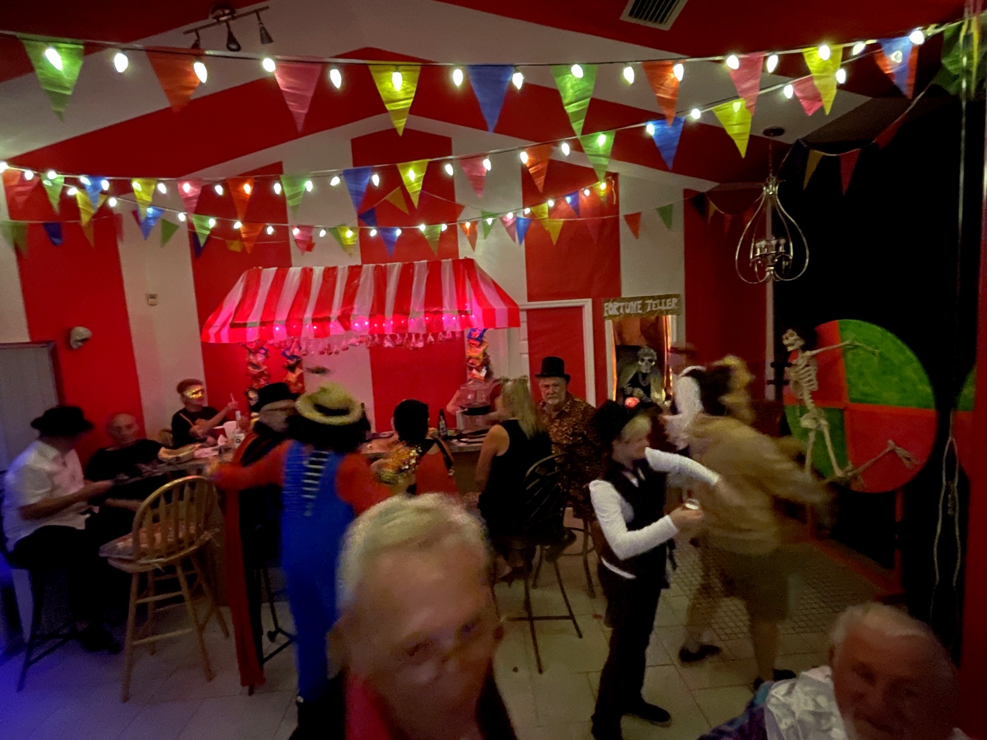 Guests moving through the carnival midway during the 2022 party