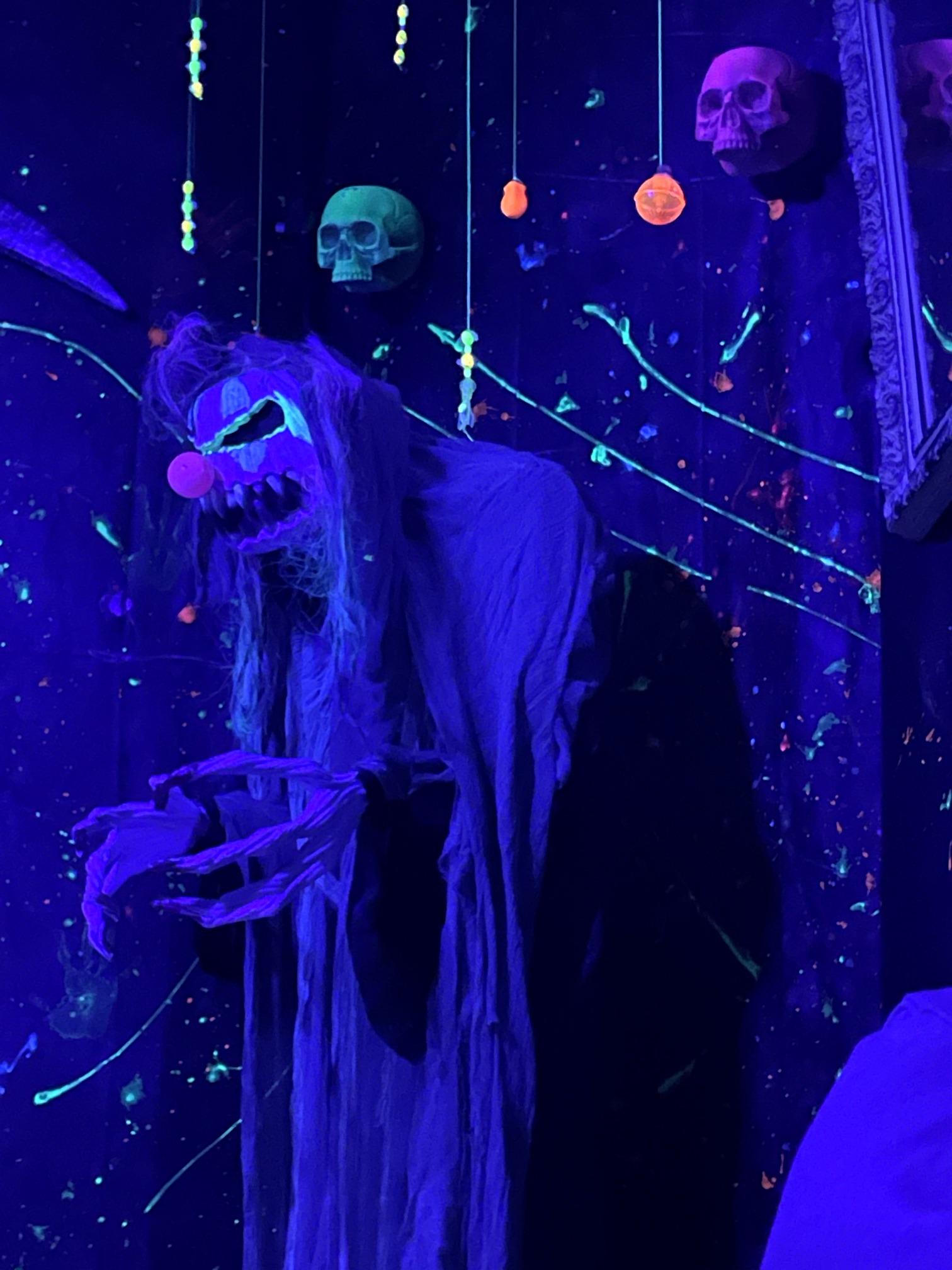 A ghostly carnival creature under blacklight during the 2022 party