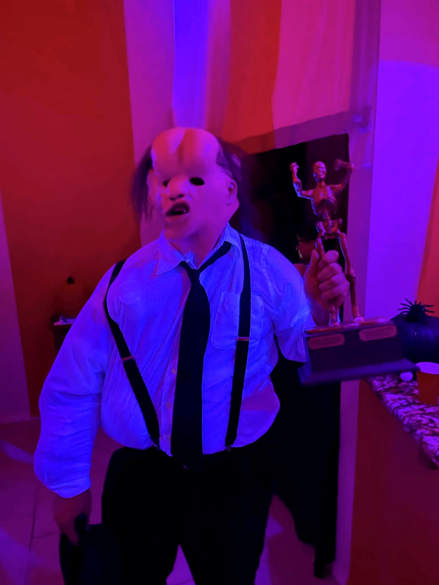 Derek as The Elephant Man holding The Skelly at the 2022 party