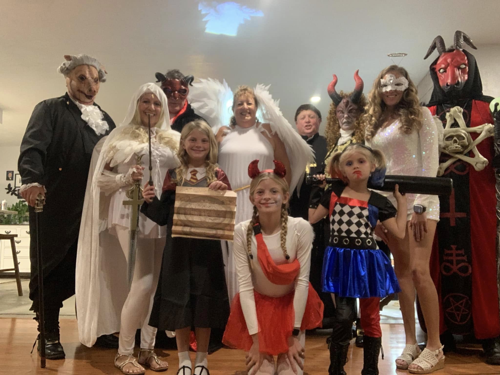 A large group portrait of devils, angels, and guests at the 2023 party