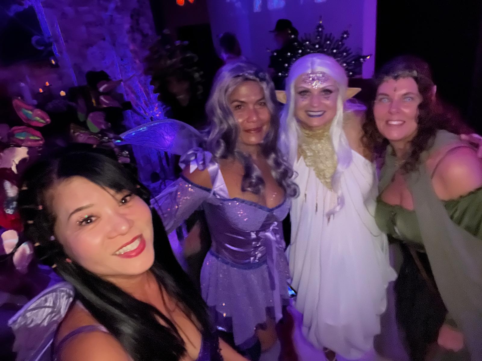 A group selfie of costumed guests dressed like ethereal beings at the 2024 party