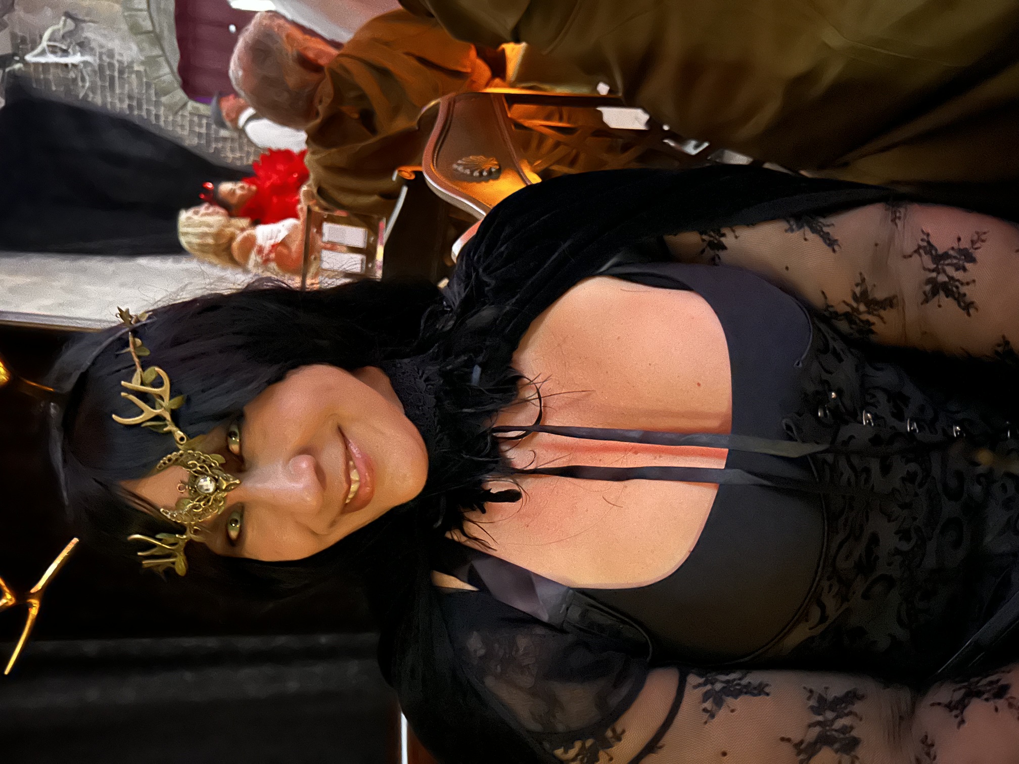 A portrait of a darkly dressed guest with antler-like headpiece at the 2024 party