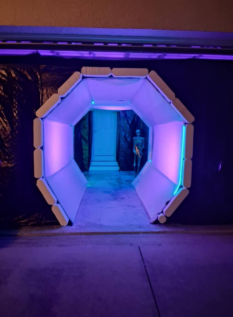 The illuminated polygonal entrance tunnel leading into The Space Station in 2025